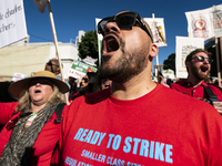 Teachers and supporters of public education march against education funding cuts during the March for Public Education in Los Angeles, Calif...