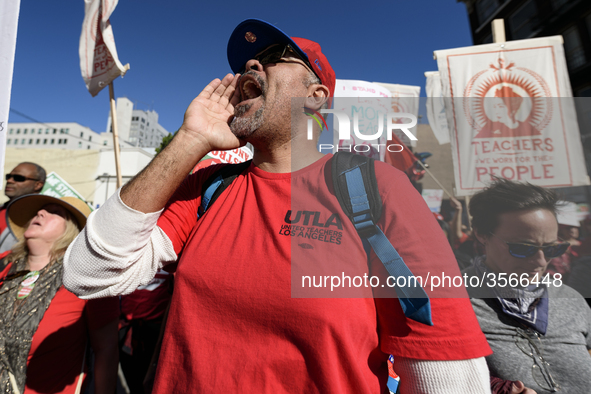 Teachers and supporters of public education march against education funding cuts during the March for Public Education in Los Angeles, Calif...