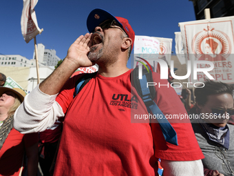 Teachers and supporters of public education march against education funding cuts during the March for Public Education in Los Angeles, Calif...