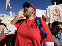 Teachers and supporters of public education march against education funding cuts during the March for Public Education in Los Angeles, Calif...