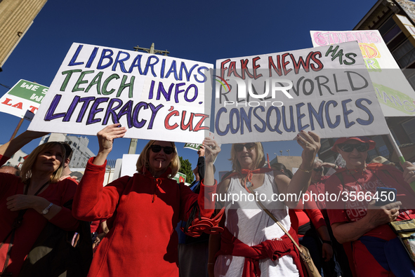 Teachers and supporters of public education march against education funding cuts during the March for Public Education in Los Angeles, Calif...