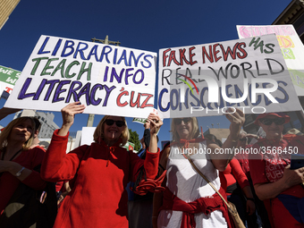 Teachers and supporters of public education march against education funding cuts during the March for Public Education in Los Angeles, Calif...