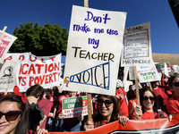 Teachers and supporters of public education march against education funding cuts during the March for Public Education in Los Angeles, Calif...