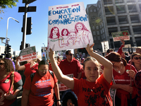 Teachers and supporters of public education march against education funding cuts during the March for Public Education in Los Angeles, Calif...