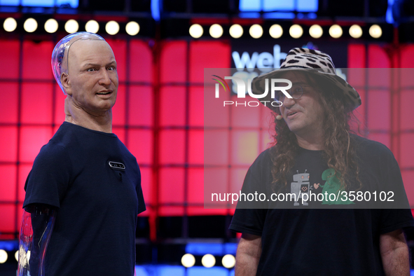 Chief Scientist of Hanson Robotics / Founder & CEO, SingularityNET, Ben Goertzel (R ) and Han The Robot speak during the Web Summit 2018 in...