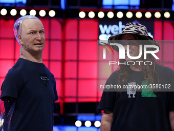 Chief Scientist of Hanson Robotics / Founder & CEO, SingularityNET, Ben Goertzel (R ) and Han The Robot speak during the Web Summit 2018 in...