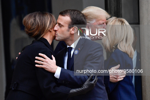 French President Emmanuel Macron and his wife Brigitte Macron accompany U.S. President Donald Trump and the first lady, Melania Trump after...