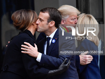 French President Emmanuel Macron and his wife Brigitte Macron accompany U.S. President Donald Trump and the first lady, Melania Trump after...