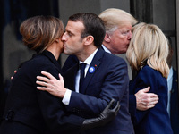 French President Emmanuel Macron and his wife Brigitte Macron accompany U.S. President Donald Trump and the first lady, Melania Trump after...