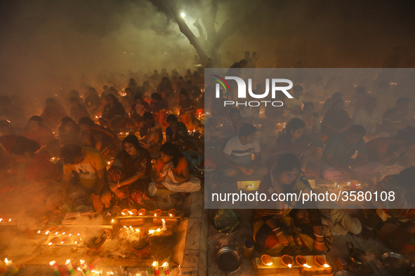 Hindu Devotees celebrating Rakher Upobas, sitting together in an old temple on last day in Narayanganj, Bangladesh, November 13, 2018. 