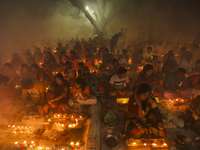 Hindu Devotees celebrating Rakher Upobas, sitting together in an old temple on last day in Narayanganj, Bangladesh, November 13, 2018. (