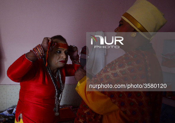 In This Picture taken on October 28, 2018, Pavitra Nimbhorker, Second head of Kinnar (Transgender) Akhara (A hindu religious group) gets rea...