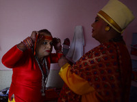 In This Picture taken on October 28, 2018, Pavitra Nimbhorker, Second head of Kinnar (Transgender) Akhara (A hindu religious group) gets rea...