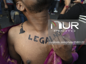 Member and supporter of the lesbian, gay, bisexual, transgender and queer (LGBTQ) community flaunts his body art at New Delhi's Queer Pride...