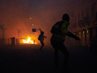 Protesters throw objects on riot police. Protesters called 'Gilets jaunes' (ie Yellow vests) protest for the third time in three weeks. Prot...