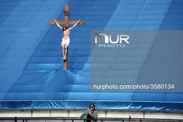 A woman and a statue of Jesus Christ are seen as during the 87th Annual Procession in honor of Our Lady of Guadalupe in Los Angeles, Califor...