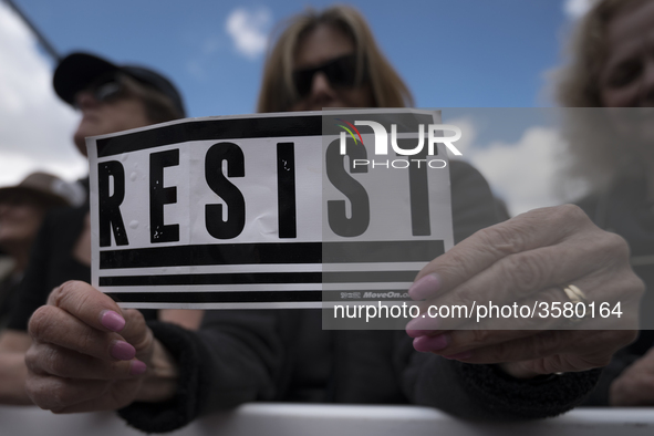 People take part in March for Our Lives in Los Angeles, California on March 24, 2018. The march was organized in response to the massacre at...