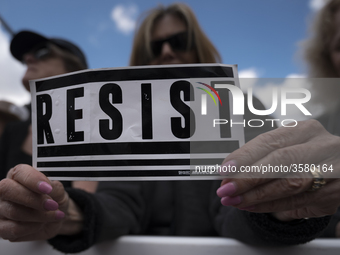 People take part in March for Our Lives in Los Angeles, California on March 24, 2018. The march was organized in response to the massacre at...