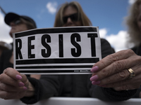 People take part in March for Our Lives in Los Angeles, California on March 24, 2018. The march was organized in response to the massacre at...