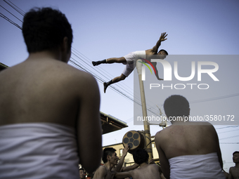 HIDA, JAPAN - APRIL 19 : Men in loincloths performs a ritual for good luck to residents during the Furukawa Festival in Hida City, Gifu pref...