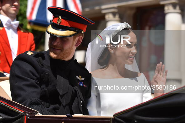 Prince Harry, Duke of Sussex and Meghan, Duchess of Sussex in the Ascot Landau carriage during the procession on The Long Walk after getting...