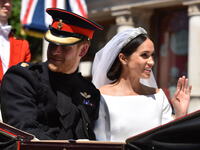 Prince Harry, Duke of Sussex and Meghan, Duchess of Sussex in the Ascot Landau carriage during the procession on The Long Walk after getting...