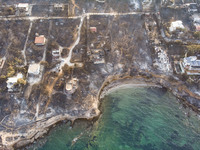 Aerial images from a drone of the devastated area of Mati in Attica, near Athens, Greece. Forest, buildings and cars are all burnt, leaving...