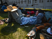 A cowboy seen resting and preparing ahead of the competition during the 105th Annual Bruce Stampede, the oldest one day rodeo in Canada. 
On...