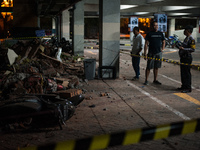 The security officers monitored the ruins of the building that hit the motorbike parking lot at Bali Galeria Mall due to the earthquake on A...