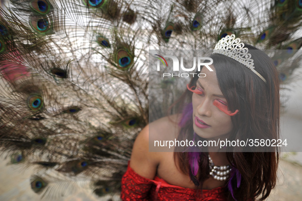 A Member of Nepalese Lesbian, Gay, Bisexual and Transgender (LGBT) pose for the photos in a LGBT pride parade during Gai Jatra Festival cele...