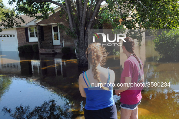 September 18, 2018 - Conway, South Carolina, United States - Kelly Arel (right) and her daughter,Victoria, look at the flood waters that sur...