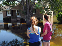 September 18, 2018 - Conway, South Carolina, United States - Kelly Arel (right) and her daughter,Victoria, look at the flood waters that sur...