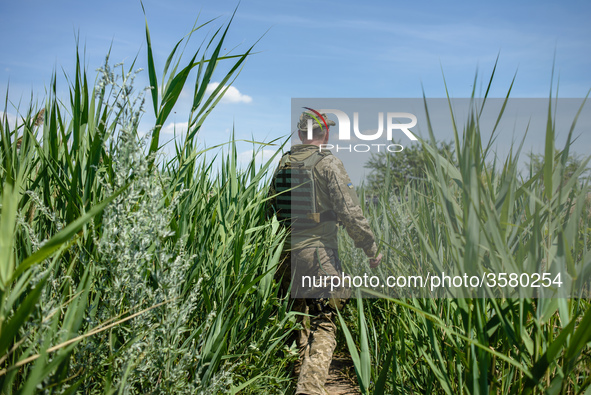 Soldiers of the Ukrainian army on the front line during the Joint Forces Operation in Donbass area, Luhansk region, Ukraine, on June 2018. D...