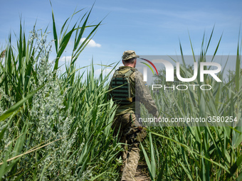 Soldiers of the Ukrainian army on the front line during the Joint Forces Operation in Donbass area, Luhansk region, Ukraine, on June 2018. D...