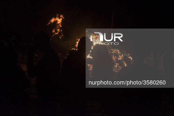 A couple of young people kiss during the night of San Juan on the beach of Santander, Spain, on June 23, 2018. The Night of San Juan is, by...