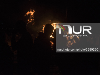 A couple of young people kiss during the night of San Juan on the beach of Santander, Spain, on June 23, 2018. The Night of San Juan is, by...