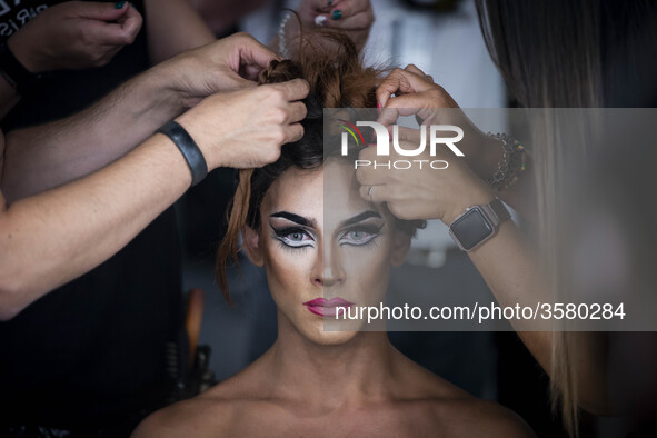 A model prepares backstage for 'Ana Locking' fashion show during Mercedes-Benz Madrid Fashion Week in Madrid, Spain. July 10, 2018.  