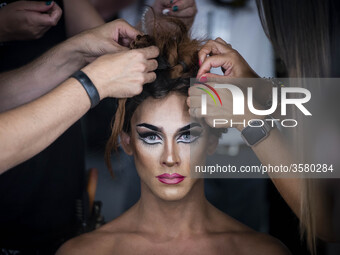 A model prepares backstage for 'Ana Locking' fashion show during Mercedes-Benz Madrid Fashion Week in Madrid, Spain. July 10, 2018.  (