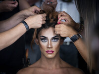 A model prepares backstage for 'Ana Locking' fashion show during Mercedes-Benz Madrid Fashion Week in Madrid, Spain. July 10, 2018.  (