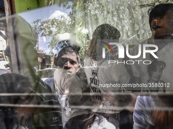 Mourners take part in the funeral wake of Jerome Dacanay, who was killed in a police drug sting operation, in Calumpit, Bulacan province, Ph...