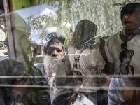 Mourners take part in the funeral wake of Jerome Dacanay, who was killed in a police drug sting operation, in Calumpit, Bulacan province, Ph...