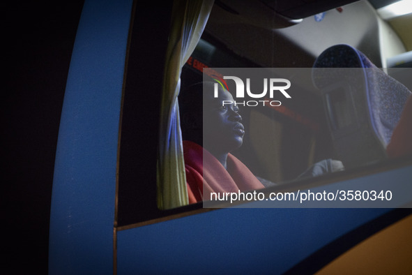 A migrant on to the bus to be transferred to a center. 11-10-2018, Malaga. 