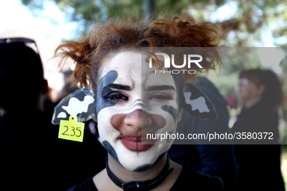 A woman with her face painted as a cow is seen during 1st March For Animal Rights in Athens, Greece on October 6, 2018 to spread the message...