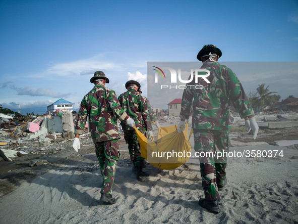 Palu, Indonesia, 05 October 2018 : Aftermath earth quake at Palu. Evacuation of dead body still going on at beach Talisha, near the beach pe...