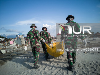 Palu, Indonesia, 05 October 2018 : Aftermath earth quake at Palu. Evacuation of dead body still going on at beach Talisha, near the beach pe...