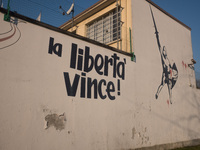 A view of the wall of historic headquarters of the Lega Nord in Via Bellerio in Milan, vandalized by murals insults, in Milan, Italy, on Jan...