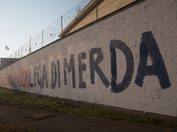 A view of the wall of historic headquarters of the Lega Nord in Via Bellerio in Milan, vandalized by murals insults, in Milan, Italy, on Jan...