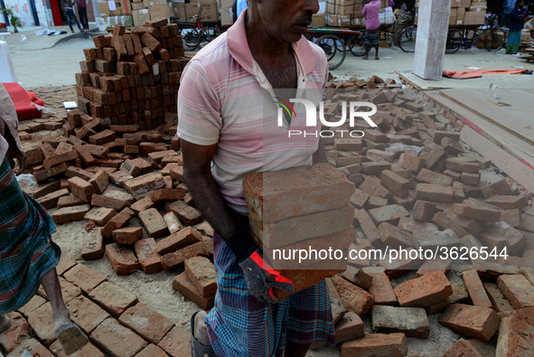 Bangladeshi day labor works in the Dhaka International Trade Fair in Dhaka, Bangladesh. On January 08, 2019. 