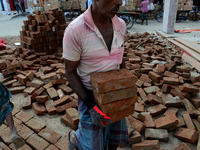 Bangladeshi day labor works in the Dhaka International Trade Fair in Dhaka, Bangladesh. On January 08, 2019. (