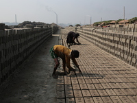 Children women brickfield workers are works in brickfields Narayanganj near Dhaka Bangladesh on January 12, 2019. (